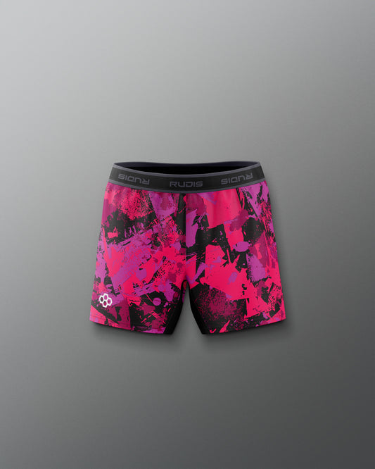 Pink and black patterned shorts on a gray background
