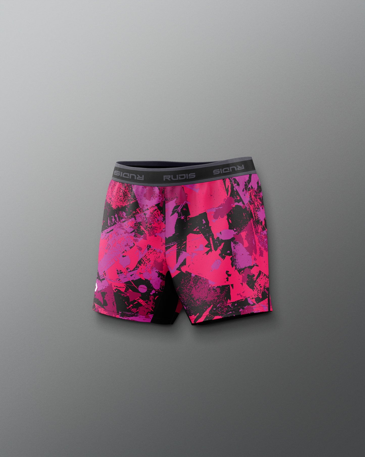 Pink and black patterned shorts on a gray background