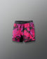 Pink and black patterned shorts on a gray background
