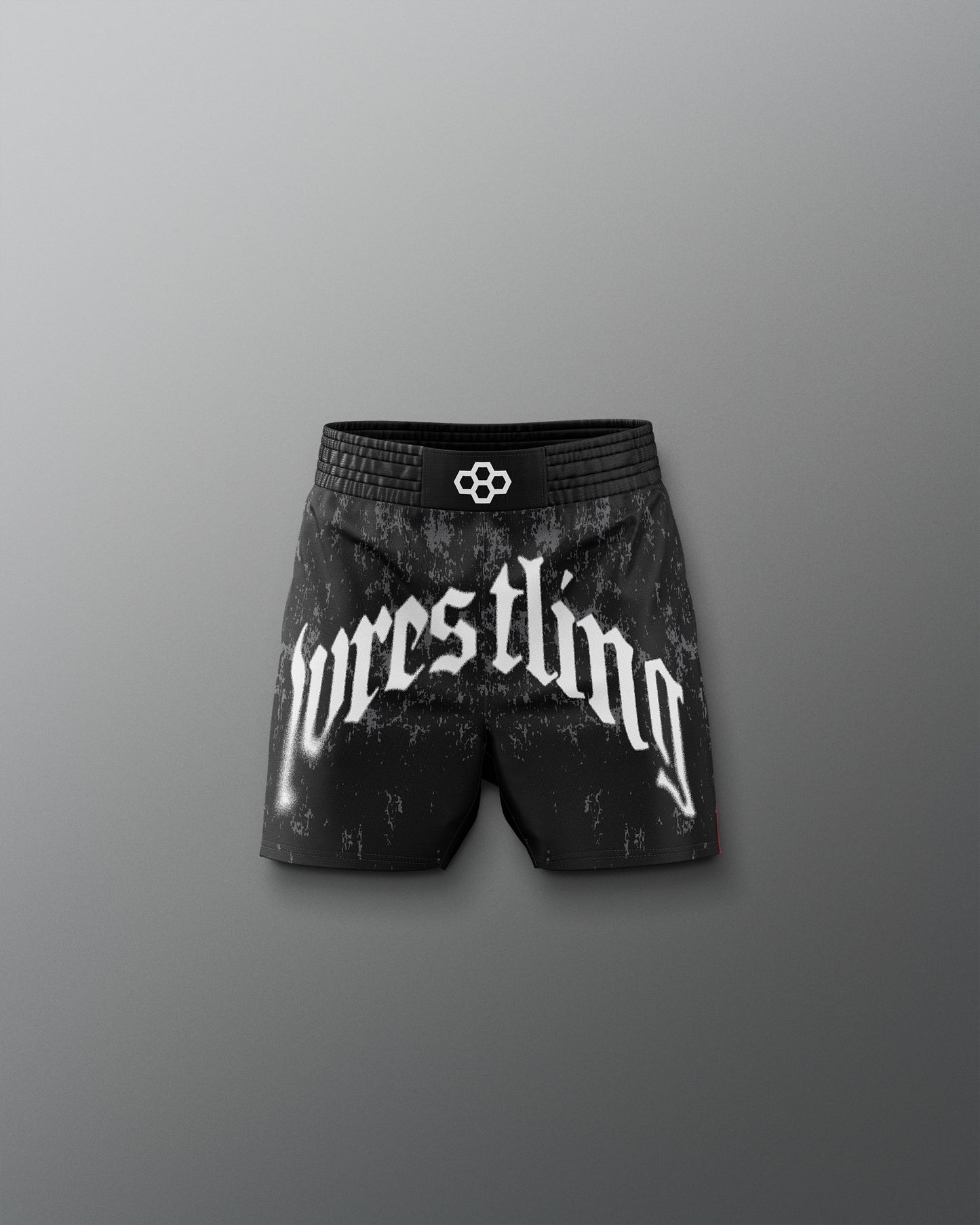 Black wrestling shorts with 'wrestling' text on a gray background