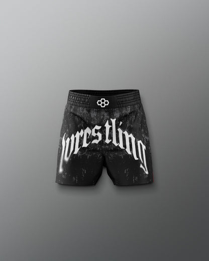 Black wrestling shorts with 'wrestling' text on a gray background