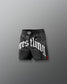Black wrestling shorts with white text on a gray background