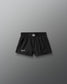 Black shorts with a brand logo on a gray background