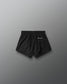 Black shorts with a brand logo on a gray background