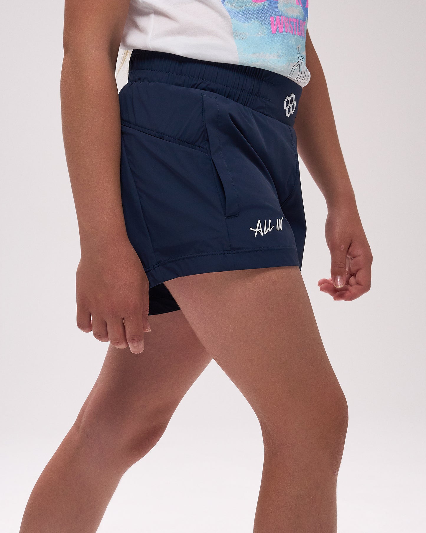 Navy athletic shorts with a logo on a white background