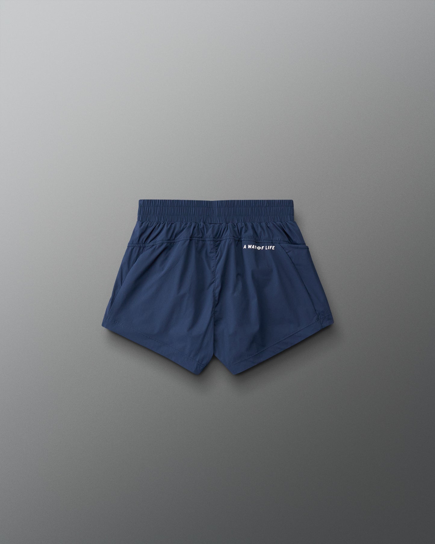 Navy blue shorts on a gray background