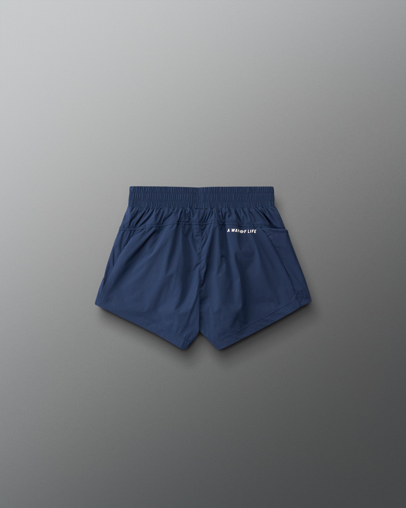 Navy blue shorts on a gray background
