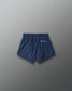 Navy blue shorts on a gray background