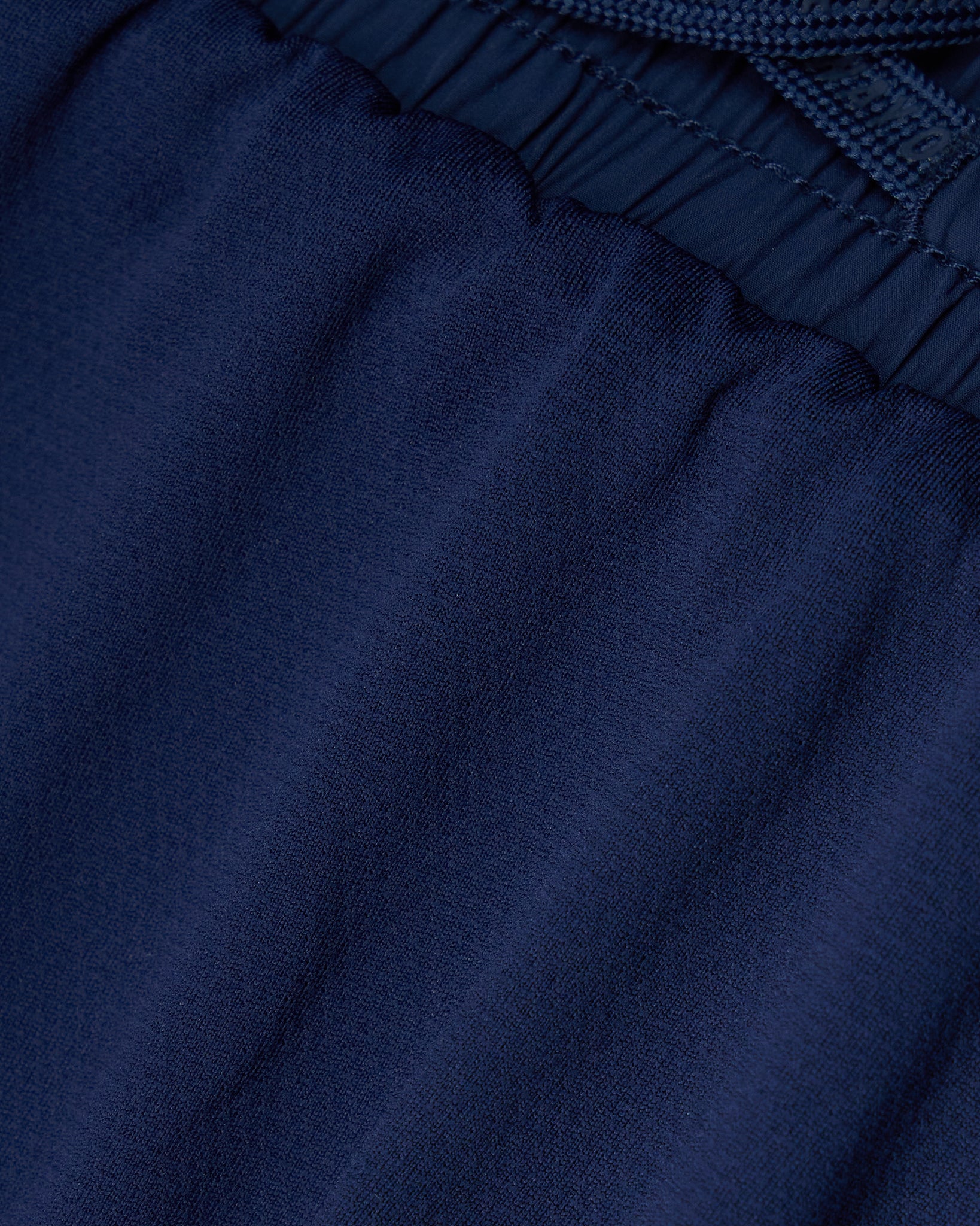 Close-up of dark blue fabric with a textured pattern