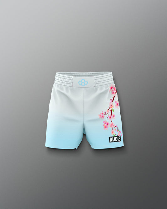 Light blue shorts with cherry blossom design on a gray background