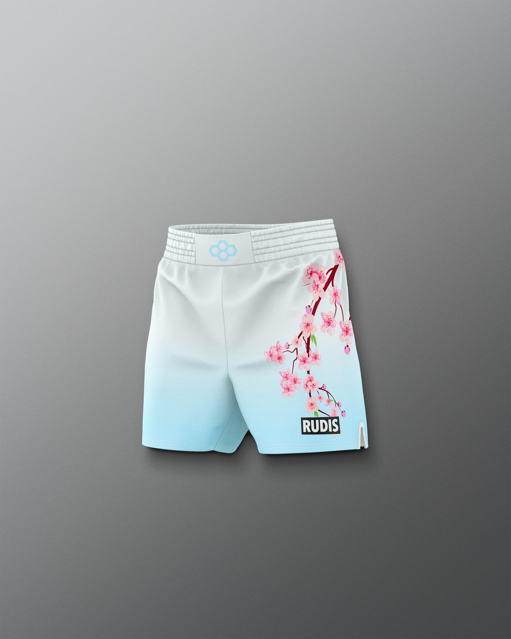 White shorts with cherry blossom design on a gray background