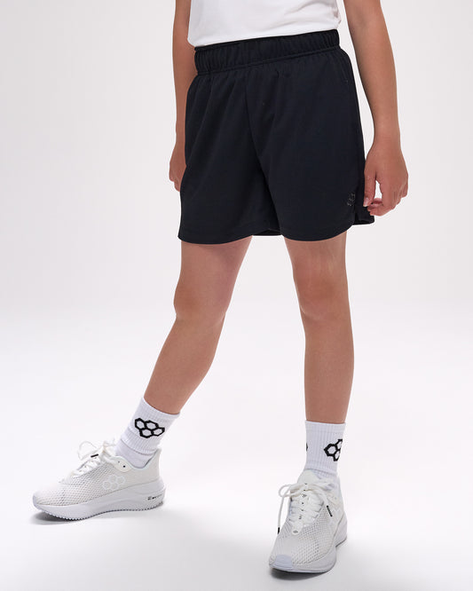 Youth athlete wearing RUDIS black mesh shorts with lightweight performance construction and athletic everyday fit