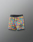 Colorful camouflage wrestling shorts with 'Rudig' branding on a gray background