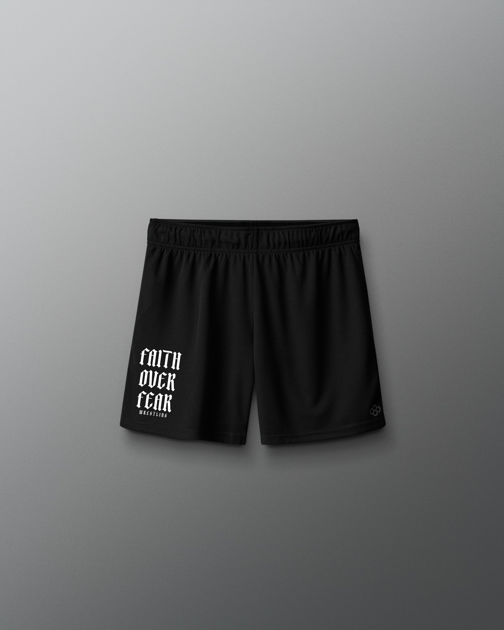 Black shorts with 'Faith Over Fear' text on a gray background