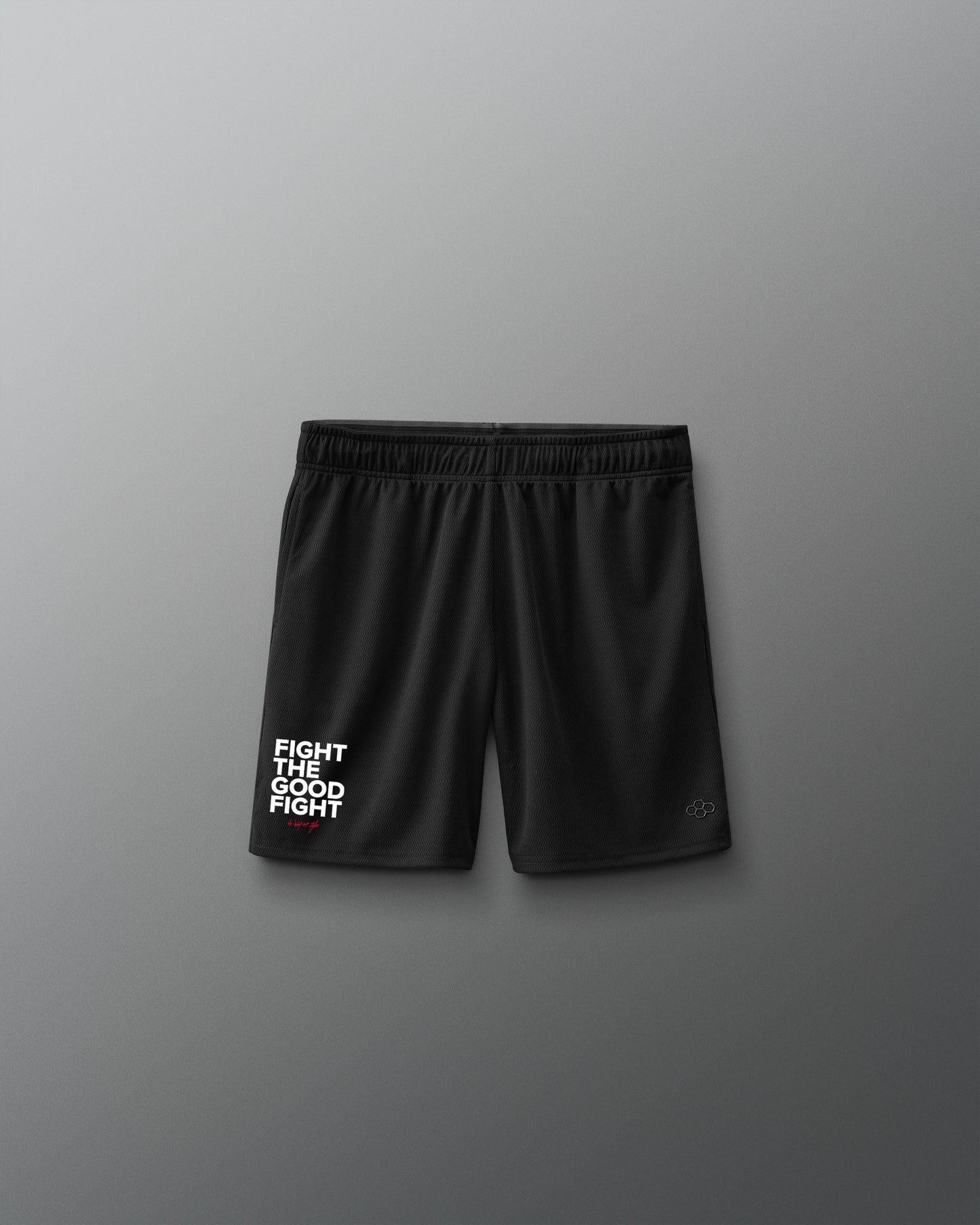 Black shorts with 'Fight the good fight' text on a gray background