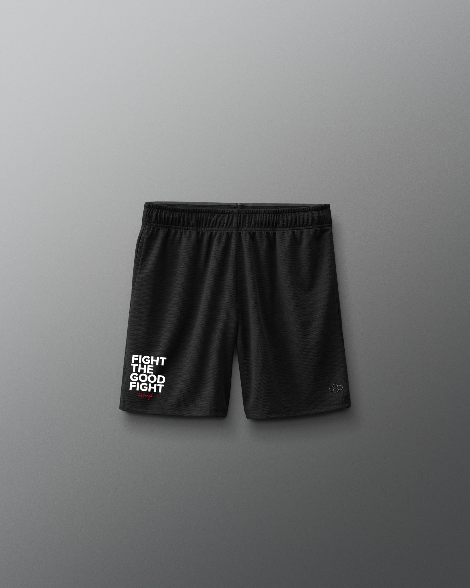 Black shorts with 'Fight the good fight' text on a gray background