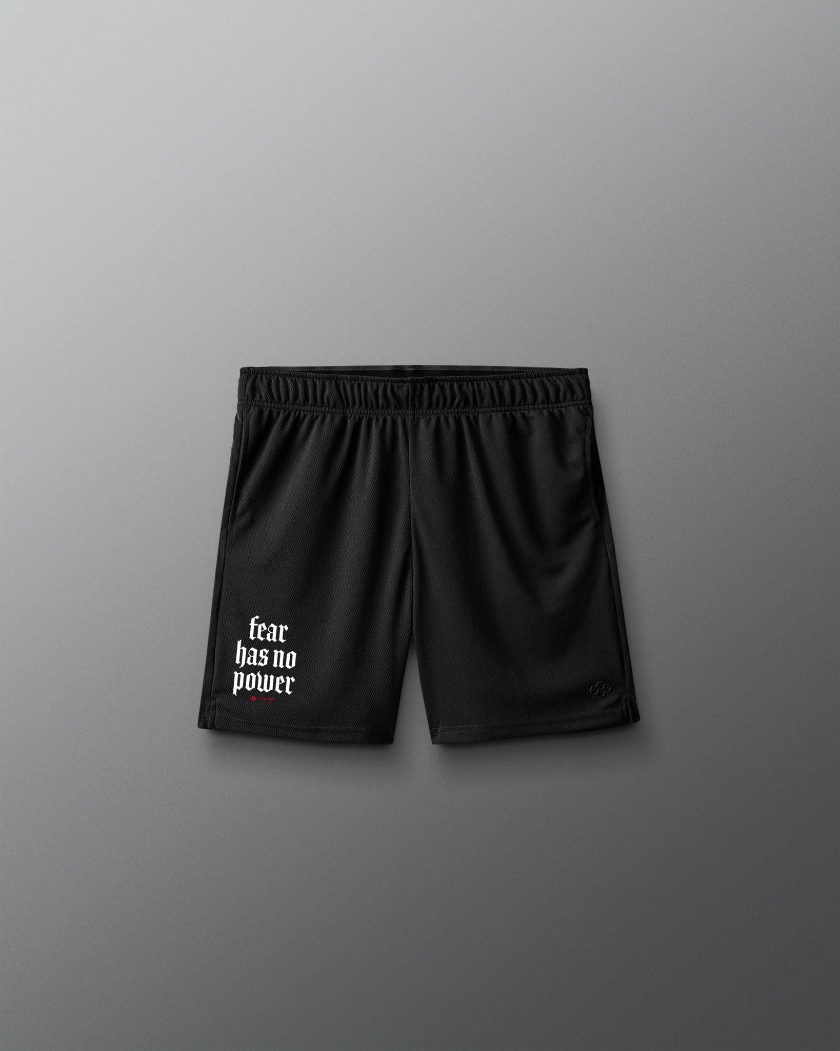 Black shorts with 'fear has no power' text on a gray background