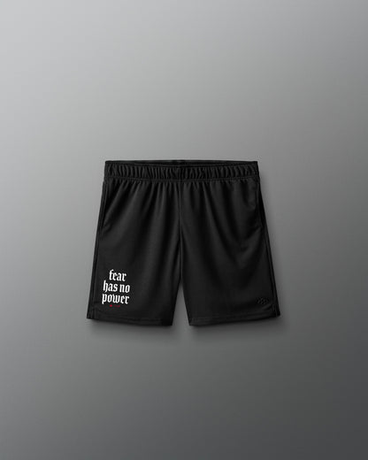 Black shorts with 'fear has no power' text on a gray background