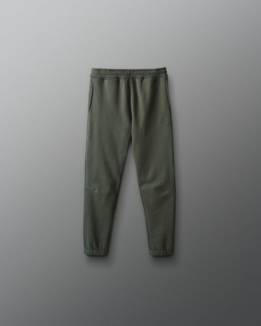 Green jogger pants on a gray background