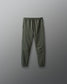 Green jogger pants on a gray background