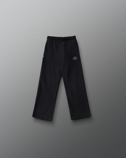 RUDIS Youth Comfort Fleece Wide Leg Sweatpant in Black, front view featuring a relaxed wide-leg fit, adjustable drawstring waistband, side pockets, and gray RUDIS logo. Copy Alt Text