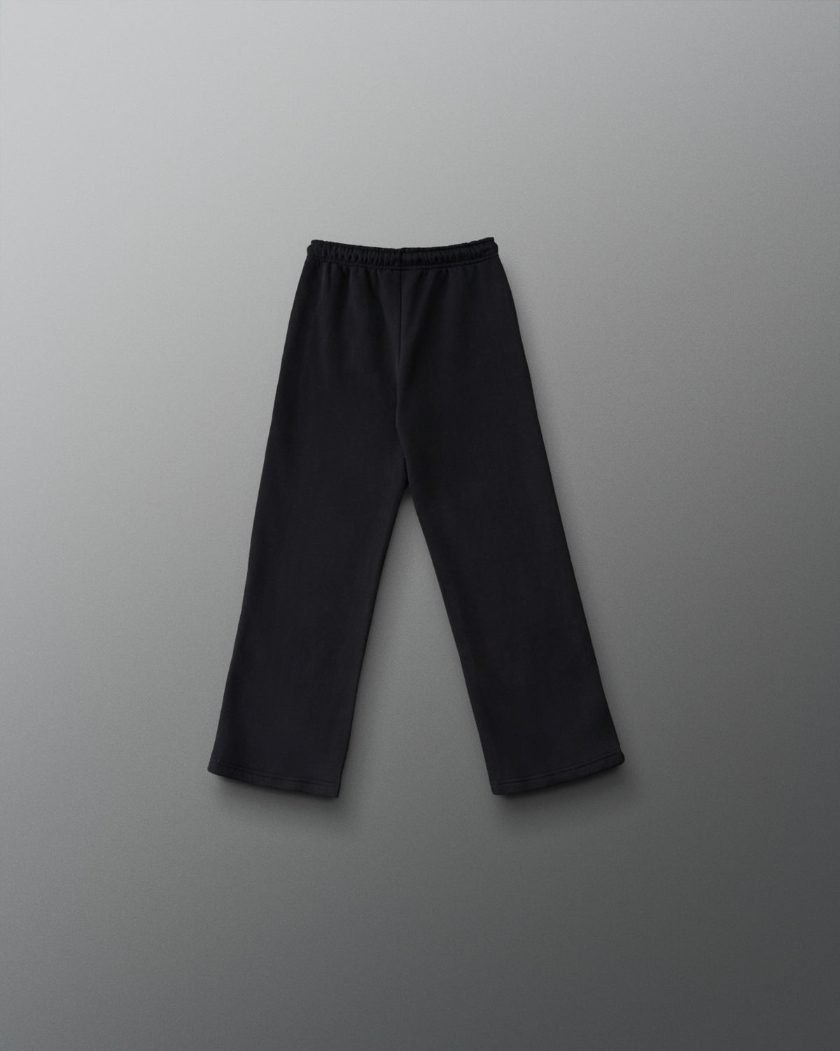 RUDIS Youth Comfort Fleece Wide Leg Sweatpant in Black, back view showing the relaxed wide-leg silhouette, elastic waistband, and straight hems. Copy Alt Text