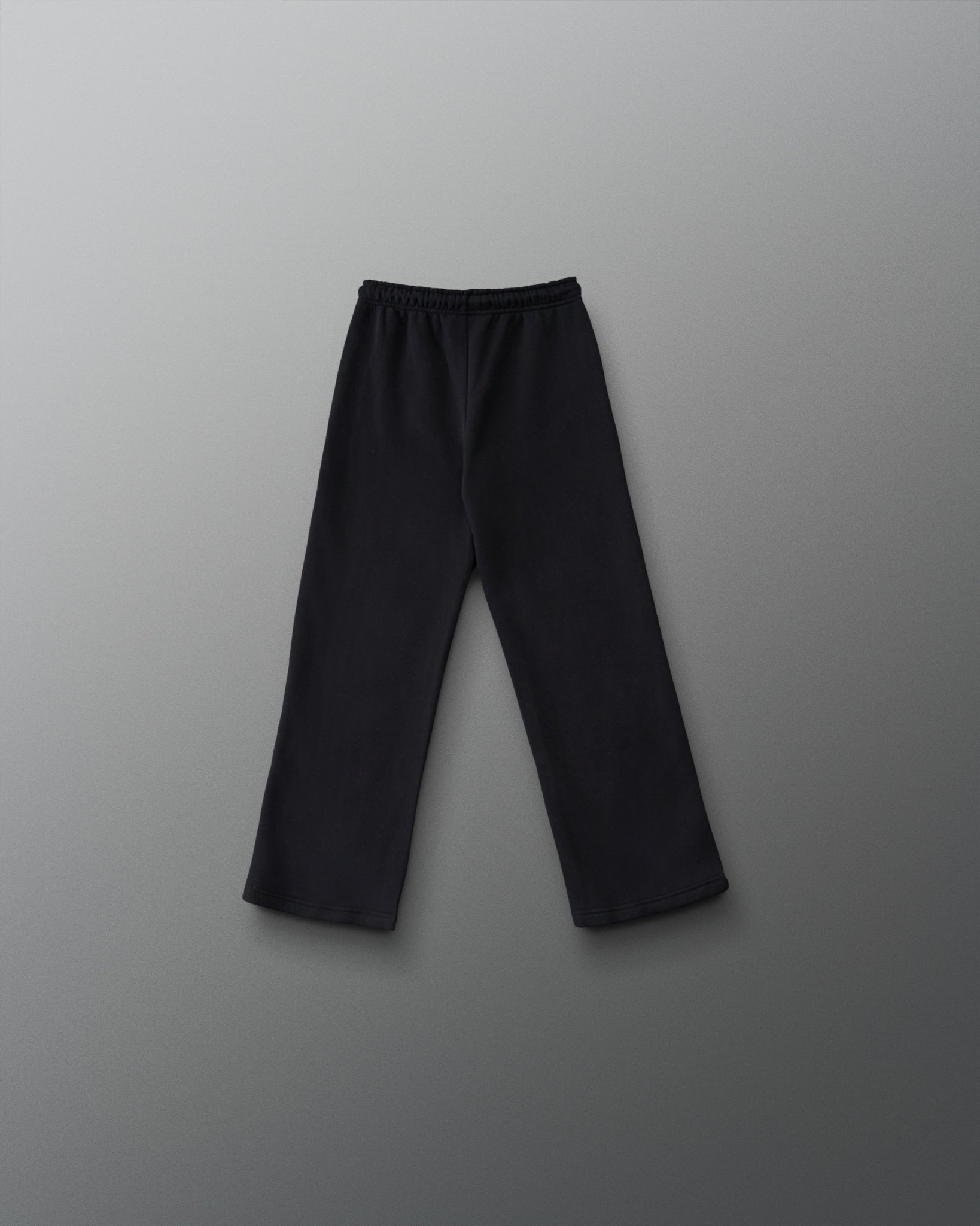 RUDIS Youth Comfort Fleece Wide Leg Sweatpant in Black, back view showing the relaxed wide-leg silhouette, elastic waistband, and straight hems. Copy Alt Text