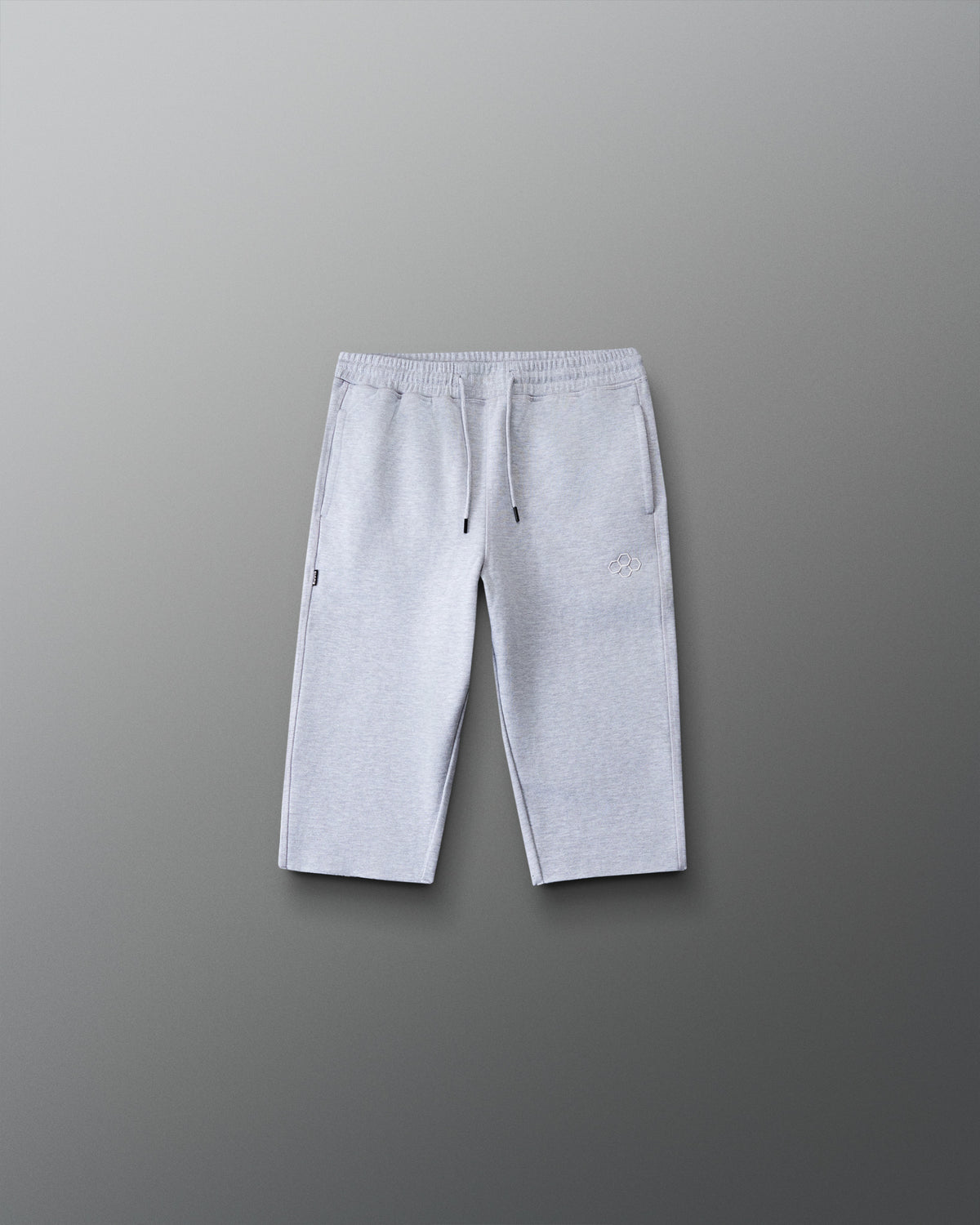Front view of the RUDIS Youth Titan Heavyweight Cut-Off Sweatpants in heather gray with drawstring waist, side pockets, and RUDIS logo.