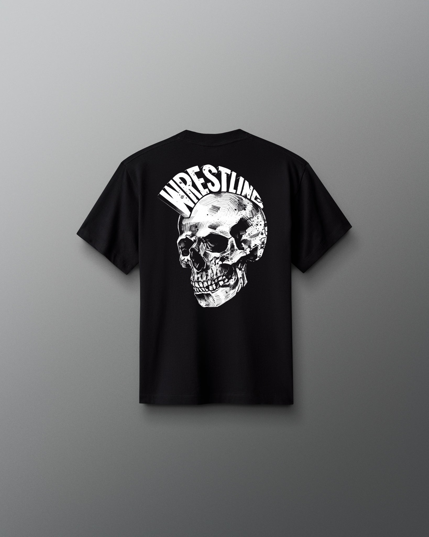 Back view of a black T-shirt featuring a large, detailed white skull graphic with the word ‘WRESTLING’ arched above it in bold, stylized letters.