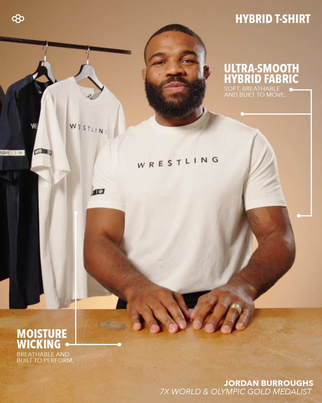 Man wearing a 'Wrestling' t-shirt with text about hybrid fabric and moisture wicking, against a beige background.