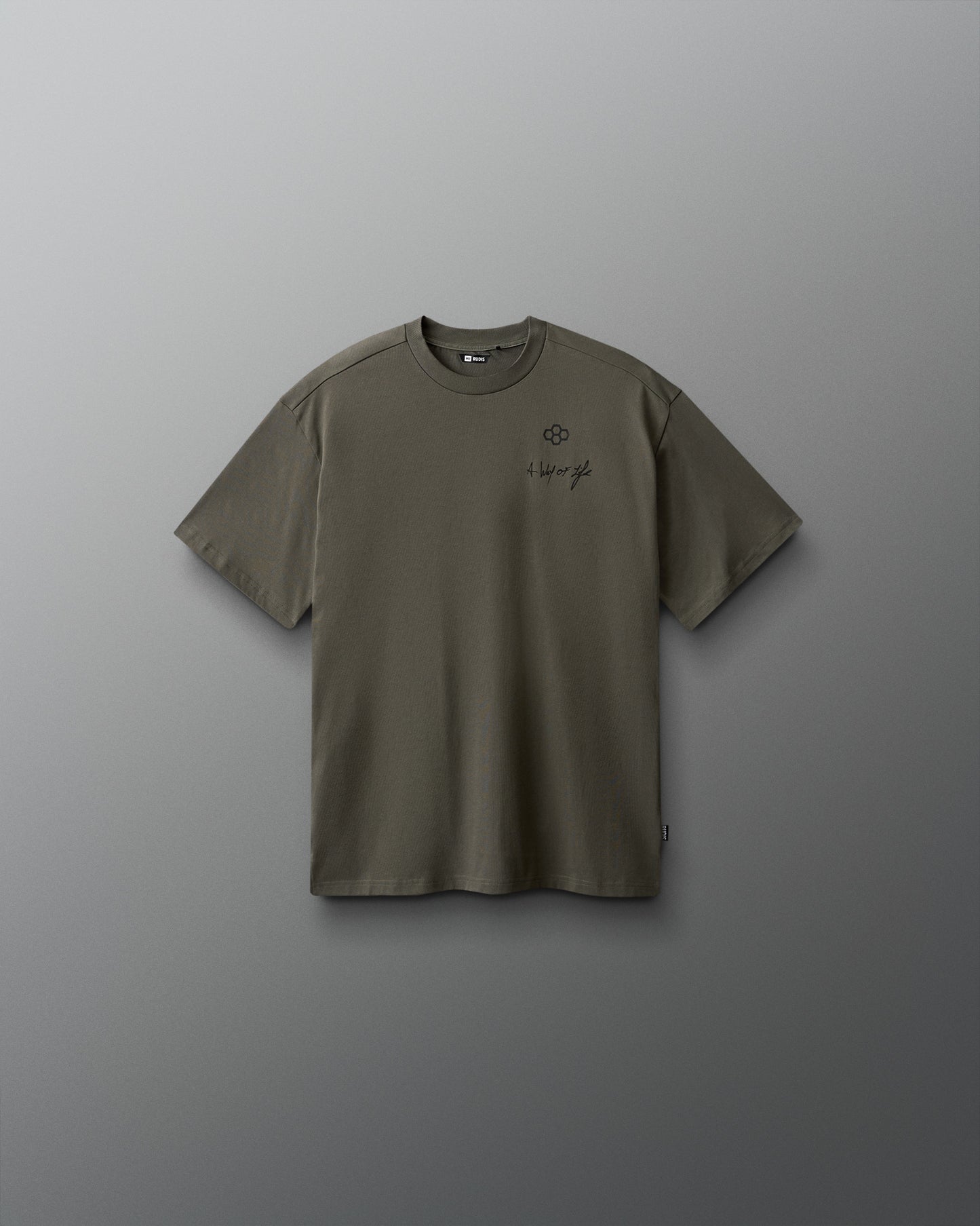 Green t-shirt with a small logo on a gray background