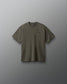 Green t-shirt with a small logo on a gray background