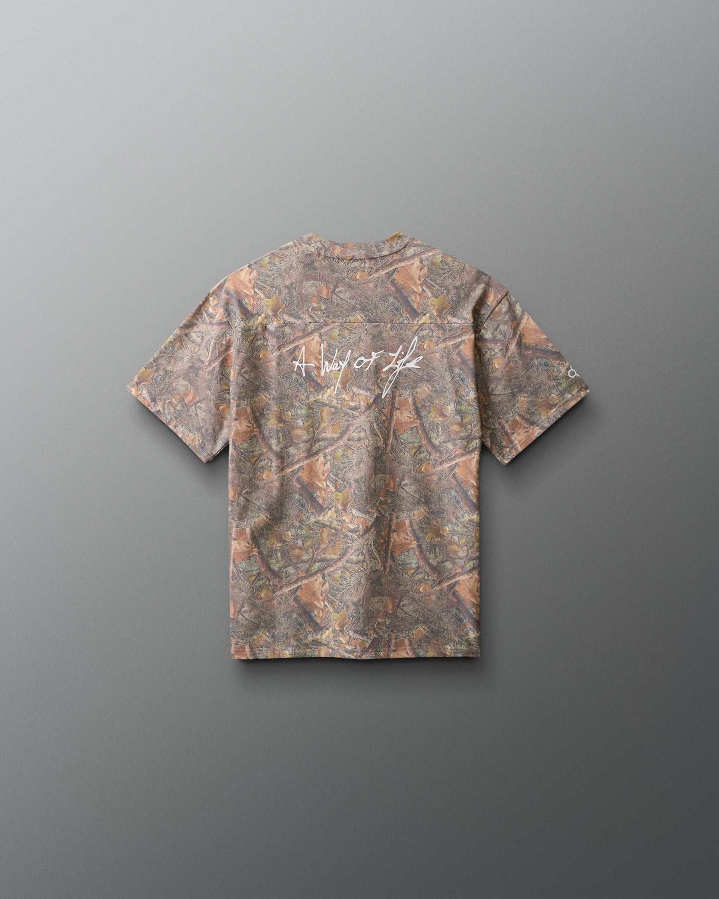 Camouflage-patterned t-shirt on a gray background