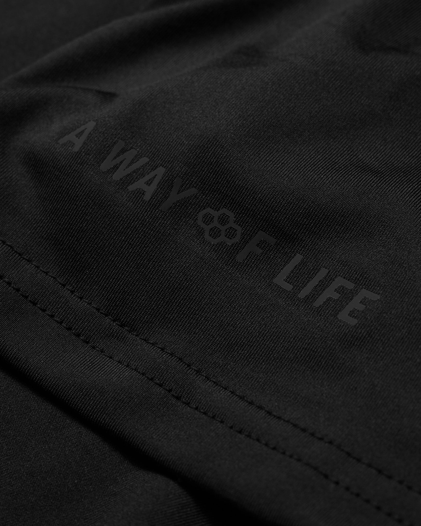 Black jacket with 'A Way of Life' logo on a dark background