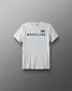 White t-shirt with 'Wrestling' text and American flag on a gray background
