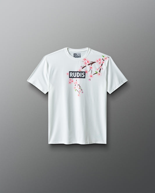 White t-shirt with floral design and 'RUDIS' logo on a gray background