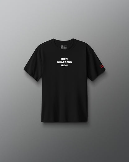 A plain black short-sleeve crewneck t-shirt shown from the back, centered against a neutral gray gradient background.
