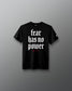 Black t-shirt with 'fear has no power' text on a gray background