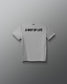 A light heather gray short-sleeve t-shirt with the phrase 'A WAY OF LIFE' printed in bold black capital letters across the chest, displayed against a dark gray gradient background.