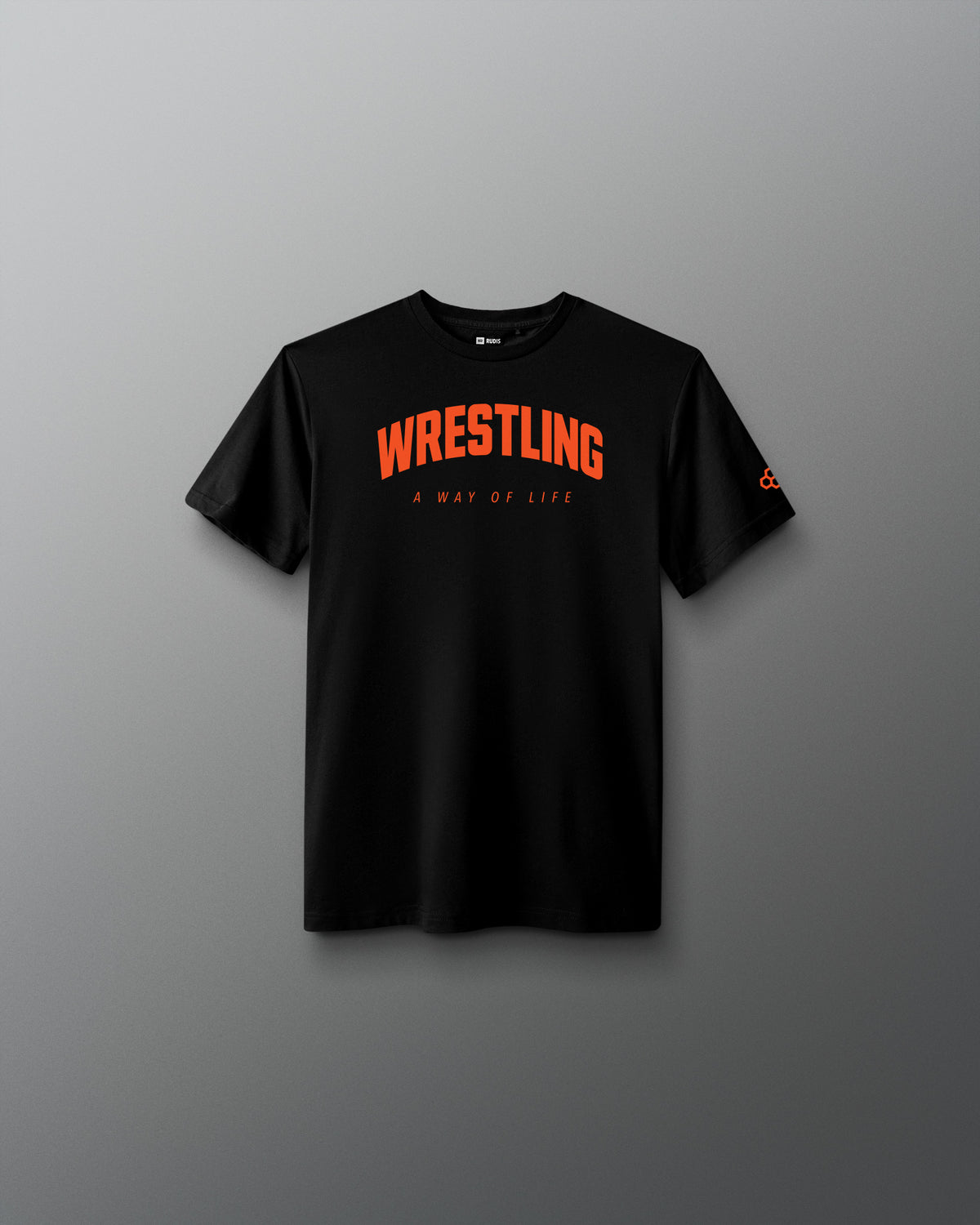 A black short-sleeve crewneck t-shirt with 'WRESTLING' printed in orange arched text and 'A WAY OF LIFE' underneath, displayed against a dark gray gradient background.