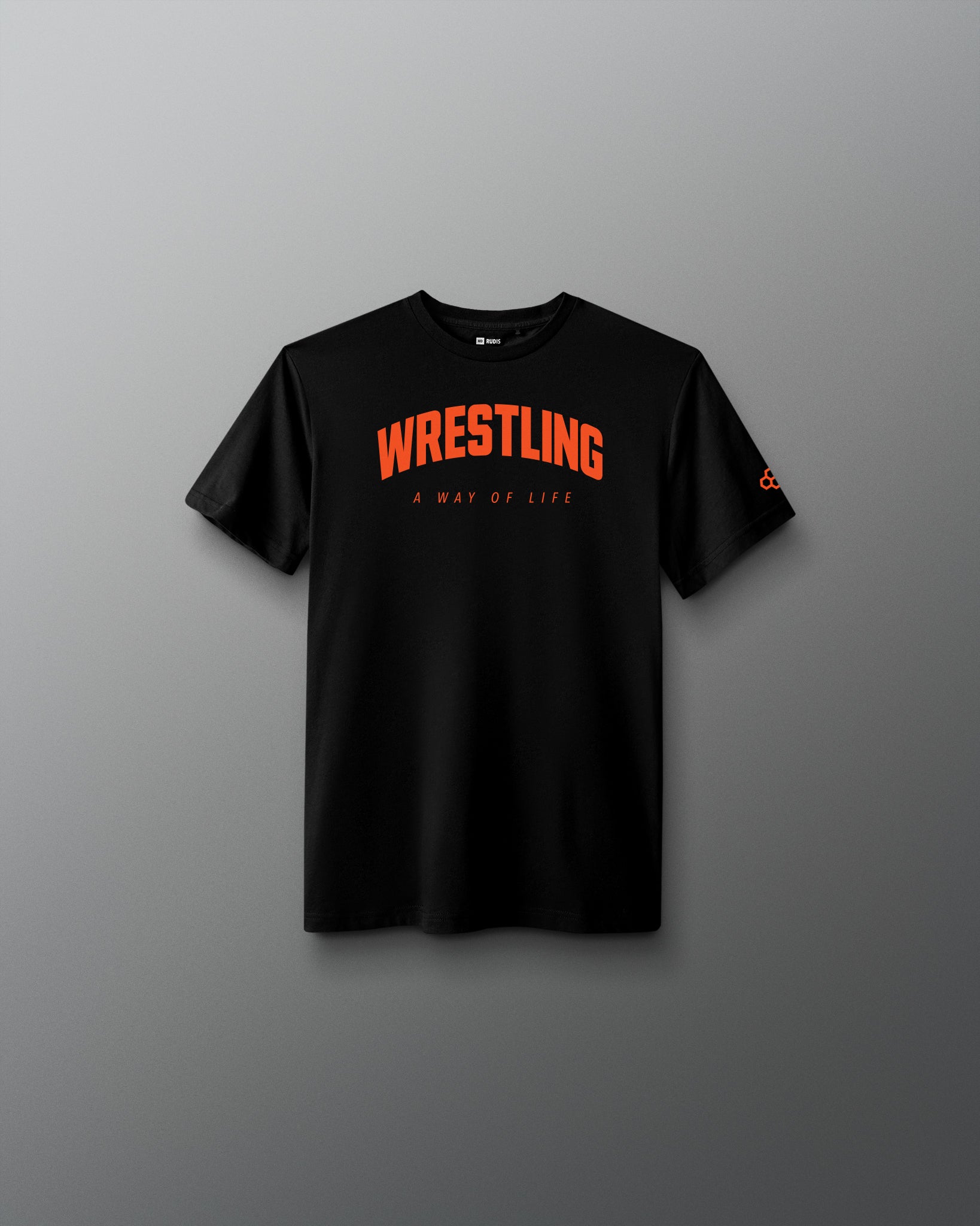 A black short-sleeve crewneck t-shirt with 'WRESTLING' printed in orange arched text and 'A WAY OF LIFE' underneath, displayed against a dark gray gradient background.