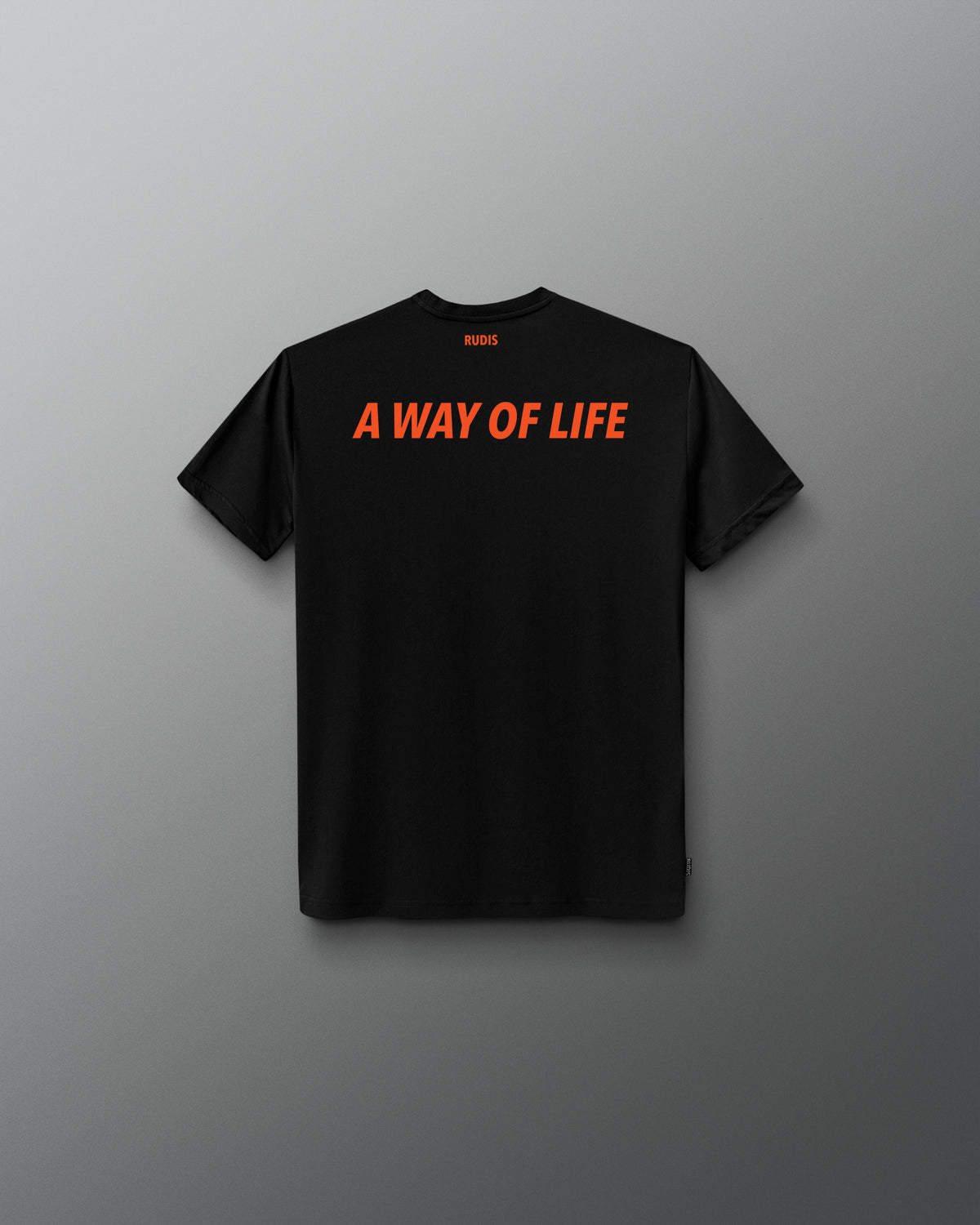A black short-sleeve t-shirt with the phrase 'A WAY OF LIFE' printed across the chest in bright orange. The shirt is displayed flat against a dark gray gradient background.