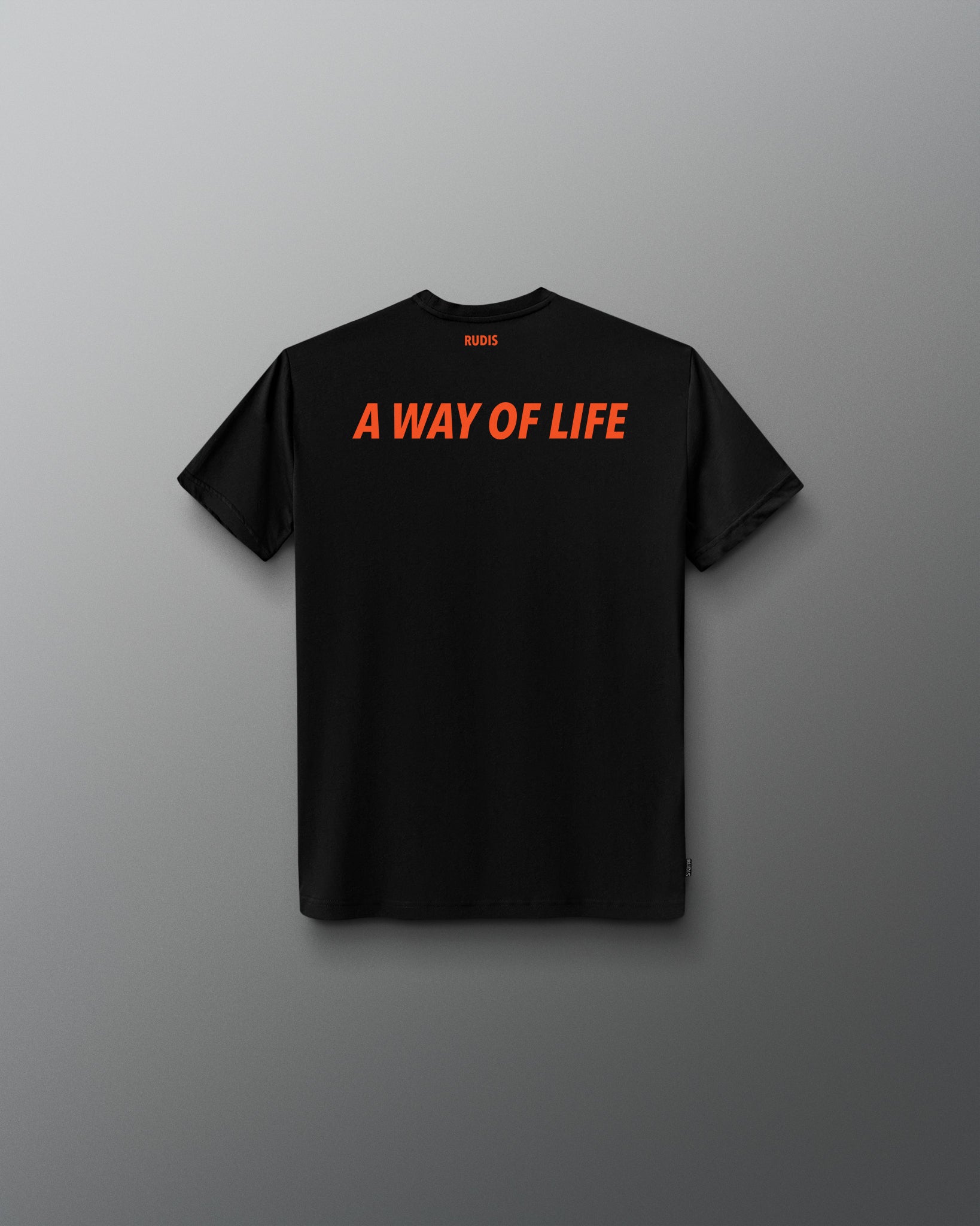 A black short-sleeve t-shirt with the phrase 'A WAY OF LIFE' printed across the chest in bright orange. The shirt is displayed flat against a dark gray gradient background.