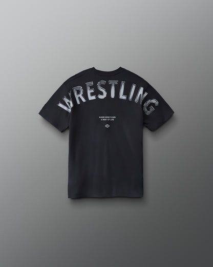 Front view of RUDIS Wrestling Back Youth Relaxed Cotton T-Shirt in Black featuring a contrasting light RUDIS chest logo.