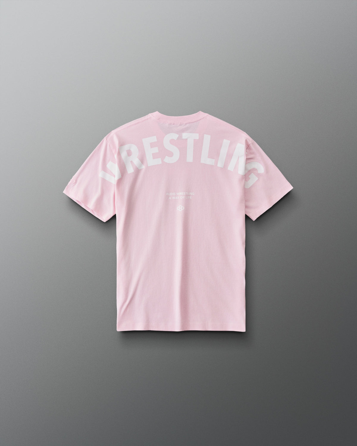 Back view of RUDIS youth wrestling T-shirt in Washed Pink with oversized white WRESTLING lettering and A WAY OF LIFE graphic.