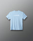 Light blue t-shirt with motivational text on a gray background