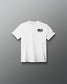 Youth white RUDIS Core Flag Elite Super Soft T-Shirt shown from the front, featuring a black American flag graphic on the left chest and contrasting RUDIS mark on the sleeve.