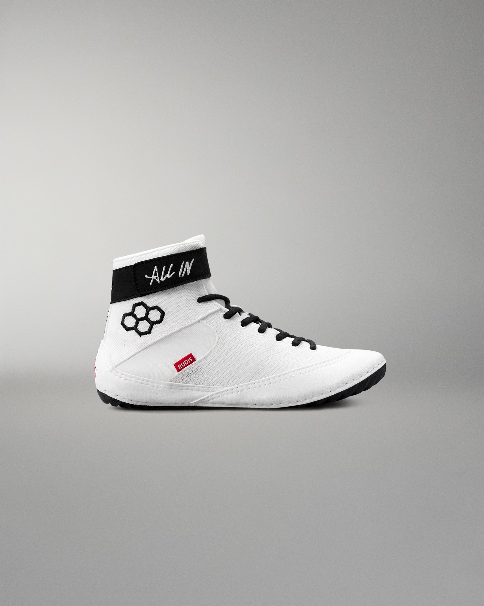 White wrestling shoe with black accents on a gray background