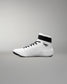 White wrestling shoe with black accents on a gray background