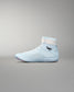 Light blue wrestling shoe with white sole on a gray background